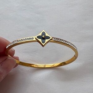 Gold-Tone Black Flower Accent Bangle Bracelet with Crystals